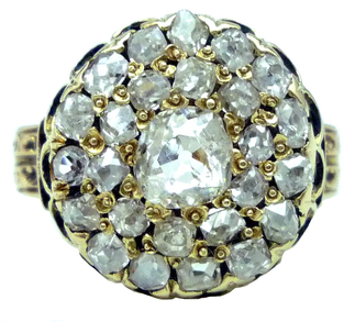 A Victorian Era old mine cut diamond cluster ring
