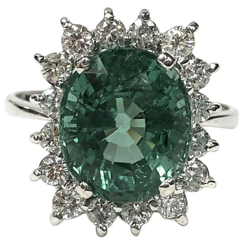 A greenish blue Paraiba tourmaline and diamond ring in 18K white gold