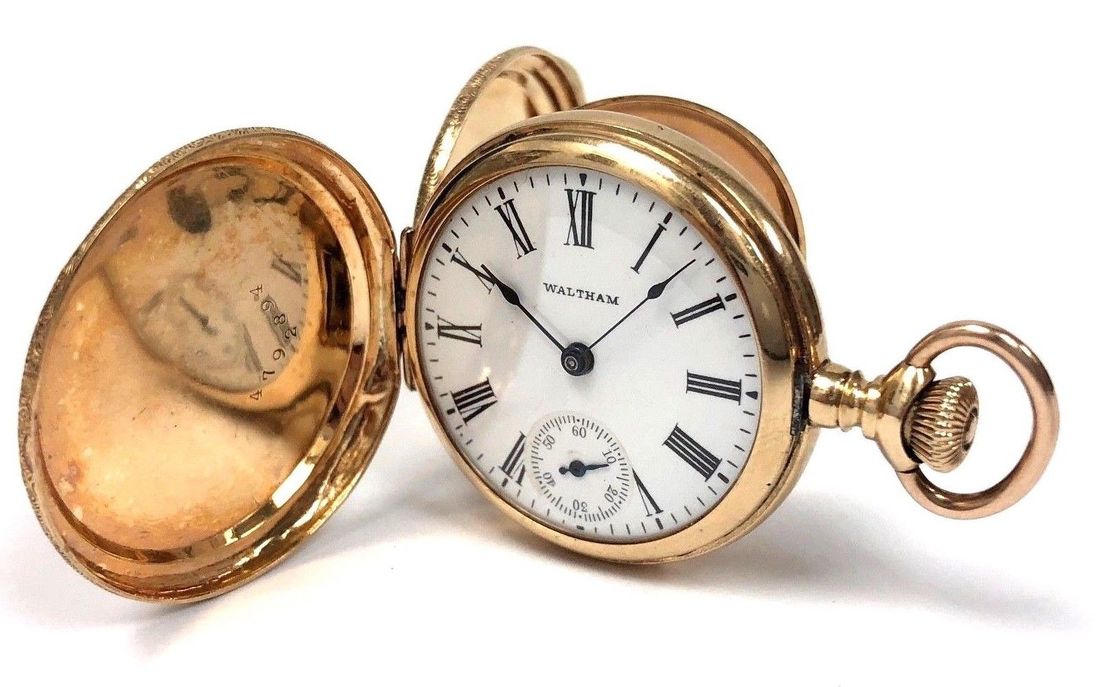 Grand feu enamel Roman dial on this antique Waltham pocket watch in a 14K gold double hunter case.