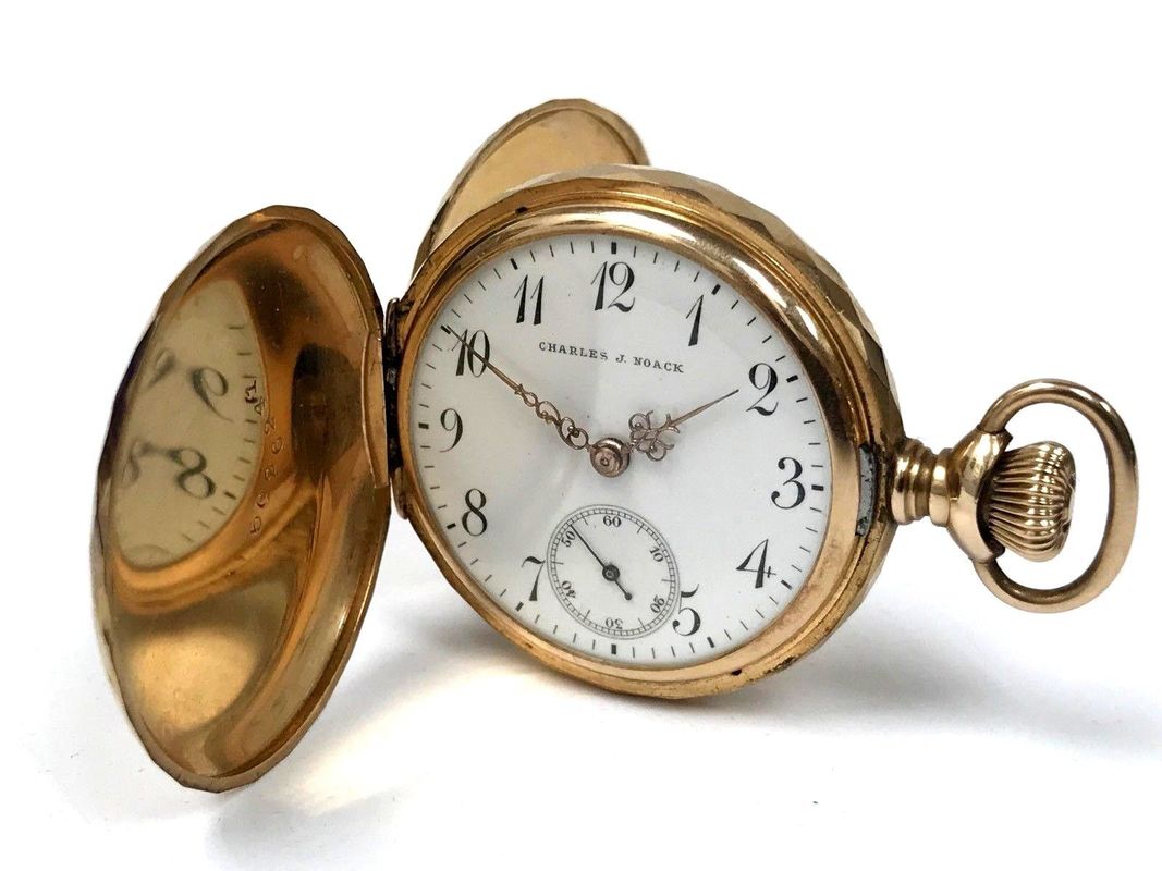 Victorian Era Charles Noack pocket watch in a 14K gold double hunter case set with an old mine cut diamond